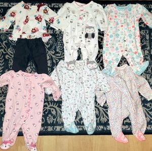 Lot of newborn girls clothes.